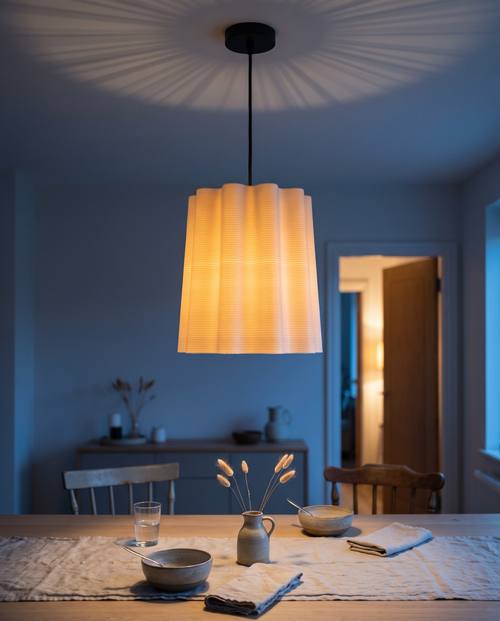 Faceted Drum lampshade 3D printed in one piece in vase mode, hanging as a pendant and glowing warm