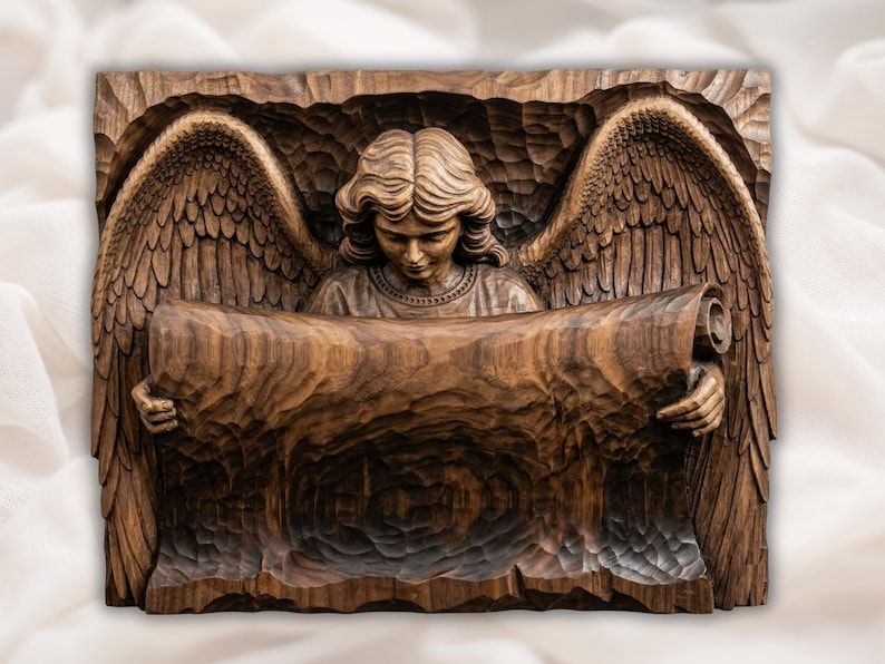 Carved wood bas-relief of a winged guardian angel with bowed head holding a wide open scroll