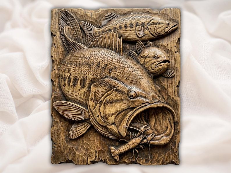 Carved wood bas-relief of a largemouth bass striking a crayfish with two smaller fish behind it