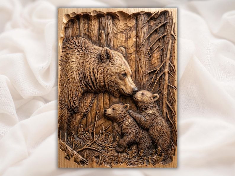 Carved wood relief of a mother bear nuzzling one cub while a second cub climbs beside her in a pine forest