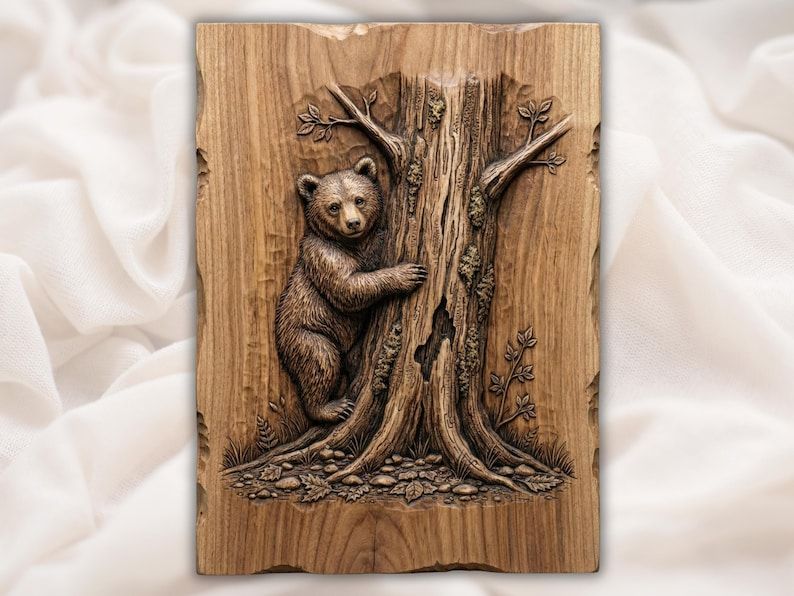 Carved wood bas-relief of a bear cub hugging a textured tree trunk with leaves and stones at the base