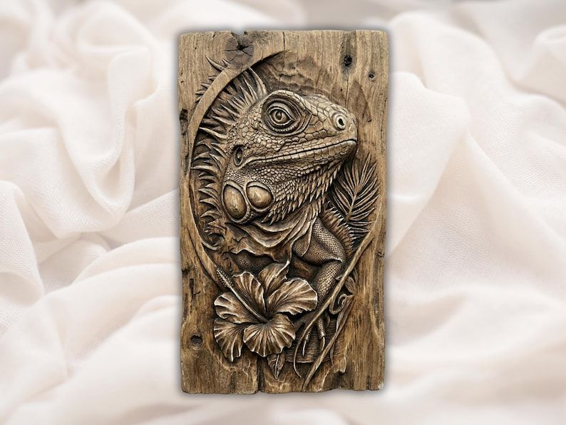 Bas-relief wood carving of an iguana head with crest, dewlap, hibiscus flower, and palm frond on a grained panel