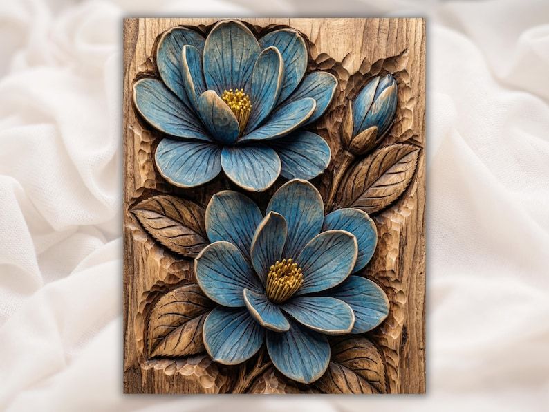Carved wood relief of two blue magnolia flowers with yellow centers and leaves on a rustic wood panel