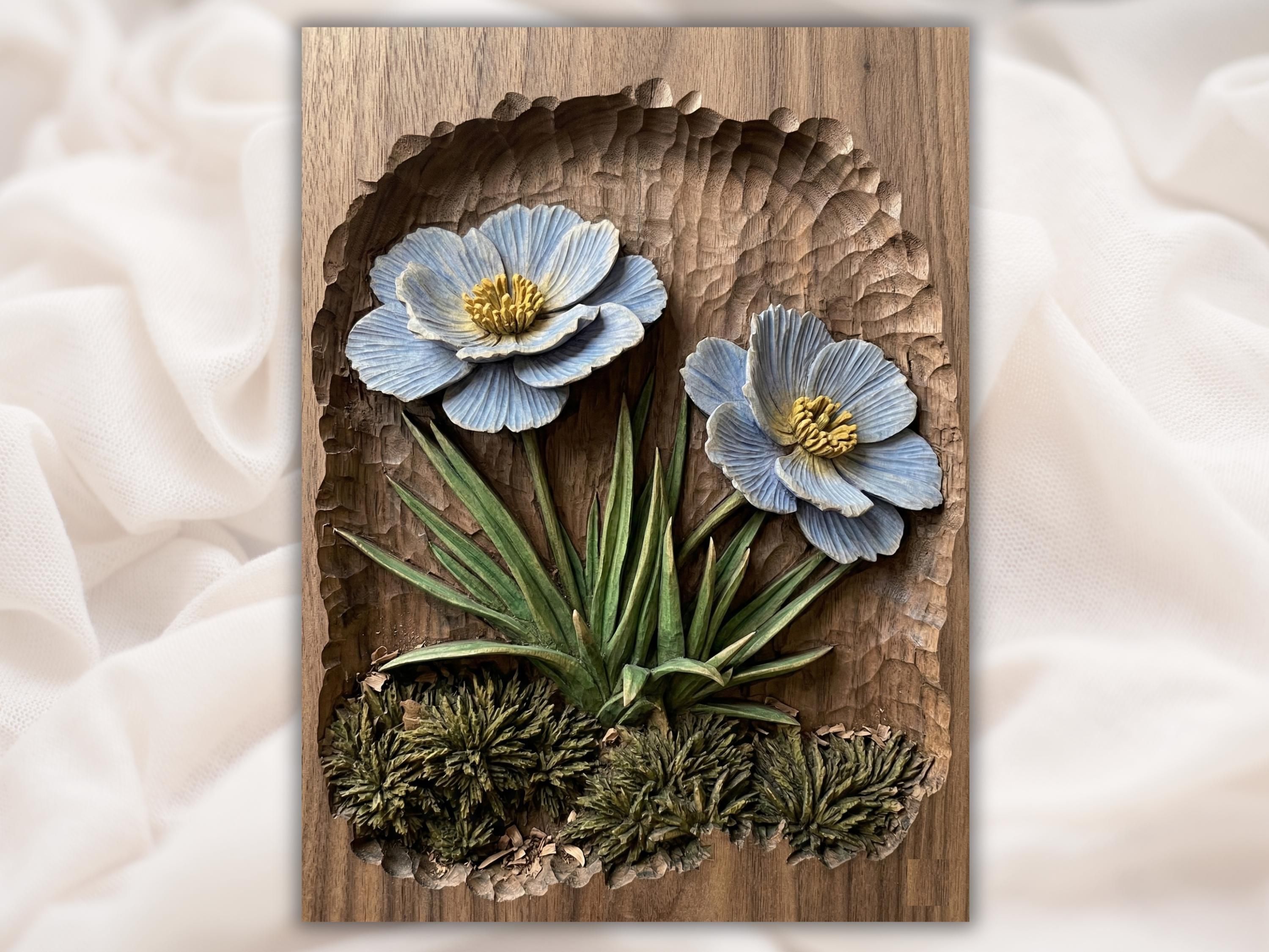 Carved wood bas-relief of two pale blue anemone wildflowers with golden centers above green leaves