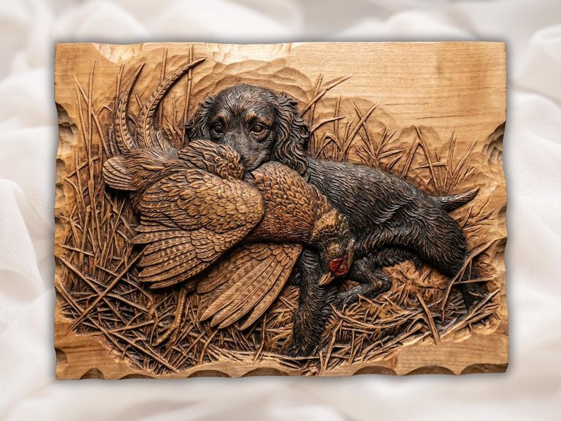 Bas-relief wood carving of a spaniel hunting dog carrying a pheasant through tall grass and reeds.