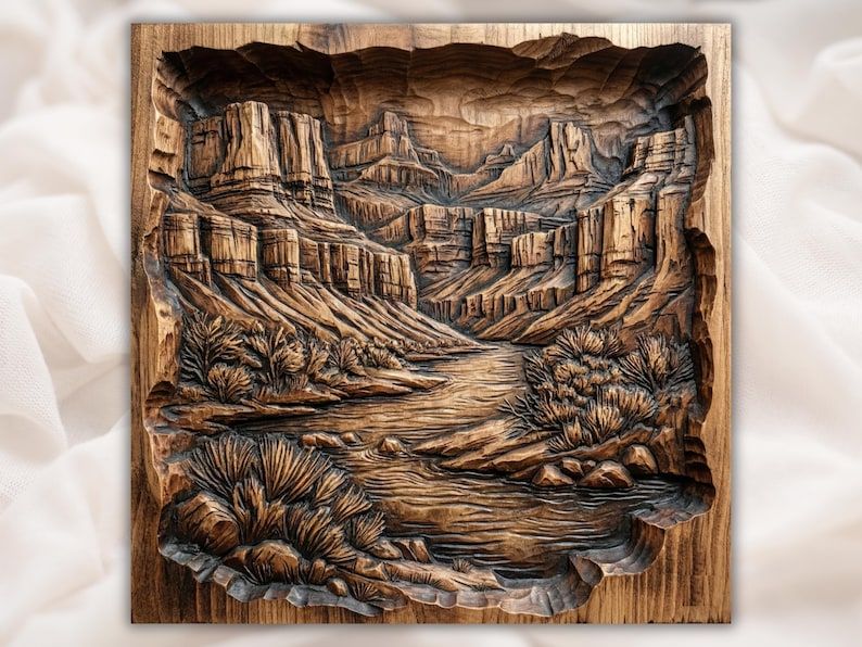 Carved wood bas-relief of a river winding through a desert canyon with mesas, cliffs, and brush.