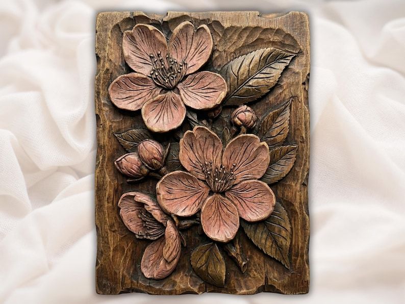 Carved wood bas-relief of two cherry blossoms with buds and veined leaves on a rectangular panel