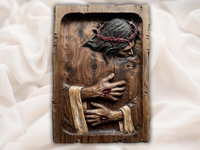 Bas-relief carving of Christ with crown of thorns embraced by wounded hands rising from wood