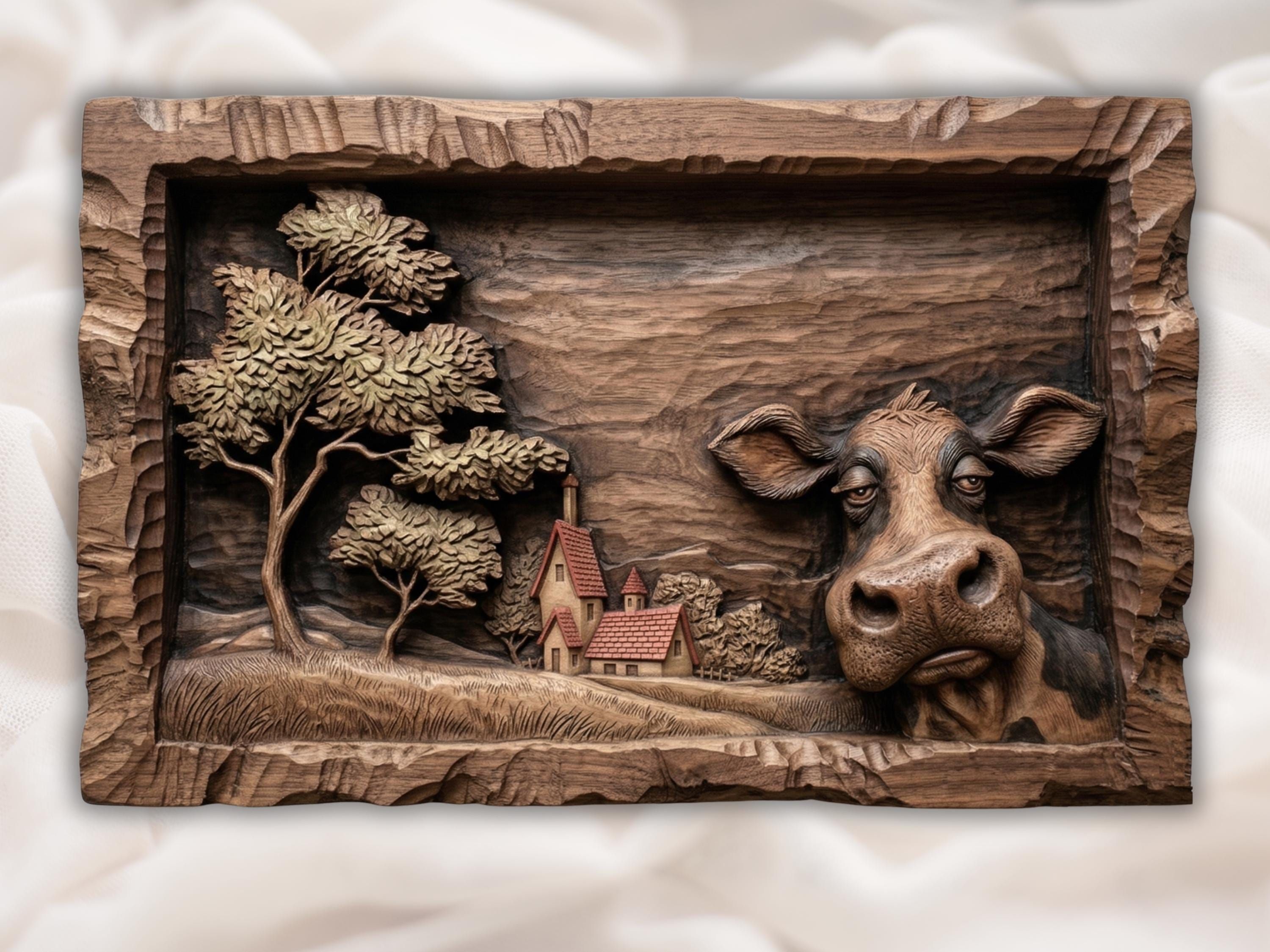 Carved bas relief of a countryside village with red-roof cottages, pine trees, and rolling hills in a wood frame