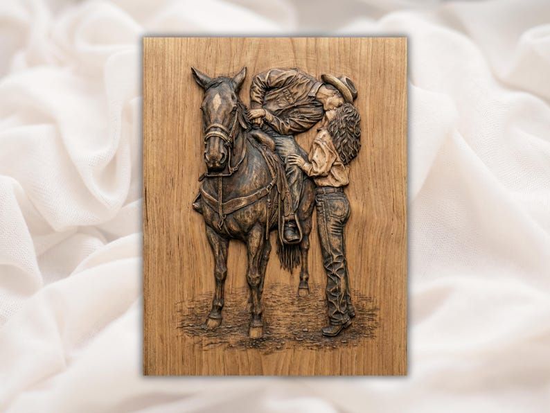 Wood bas-relief of a cowboy leaning from his horse to kiss a cowgirl standing beside the saddle