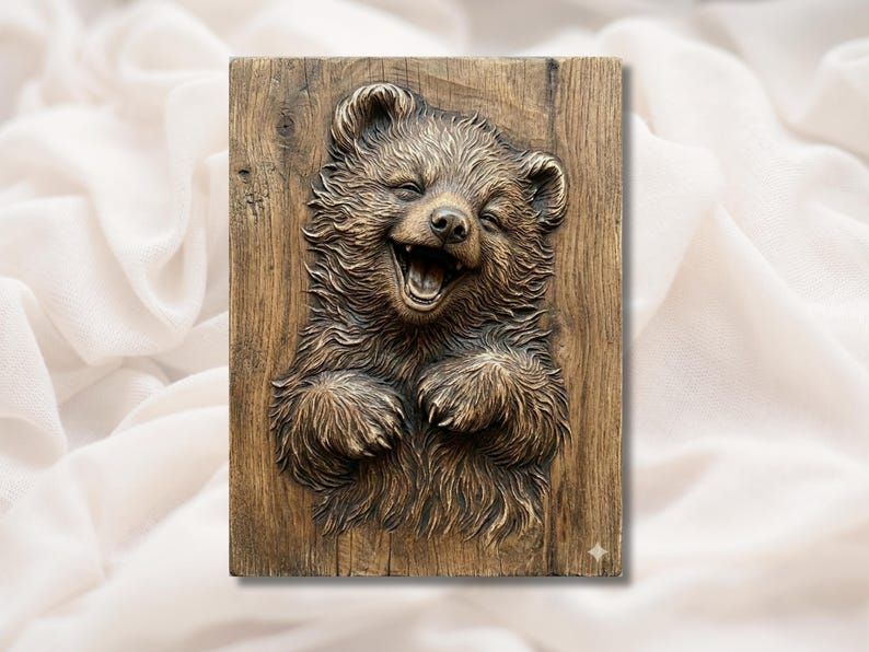 Carved wood bas-relief of a laughing bear cub with fluffy fur and paws reaching forward on a panel
