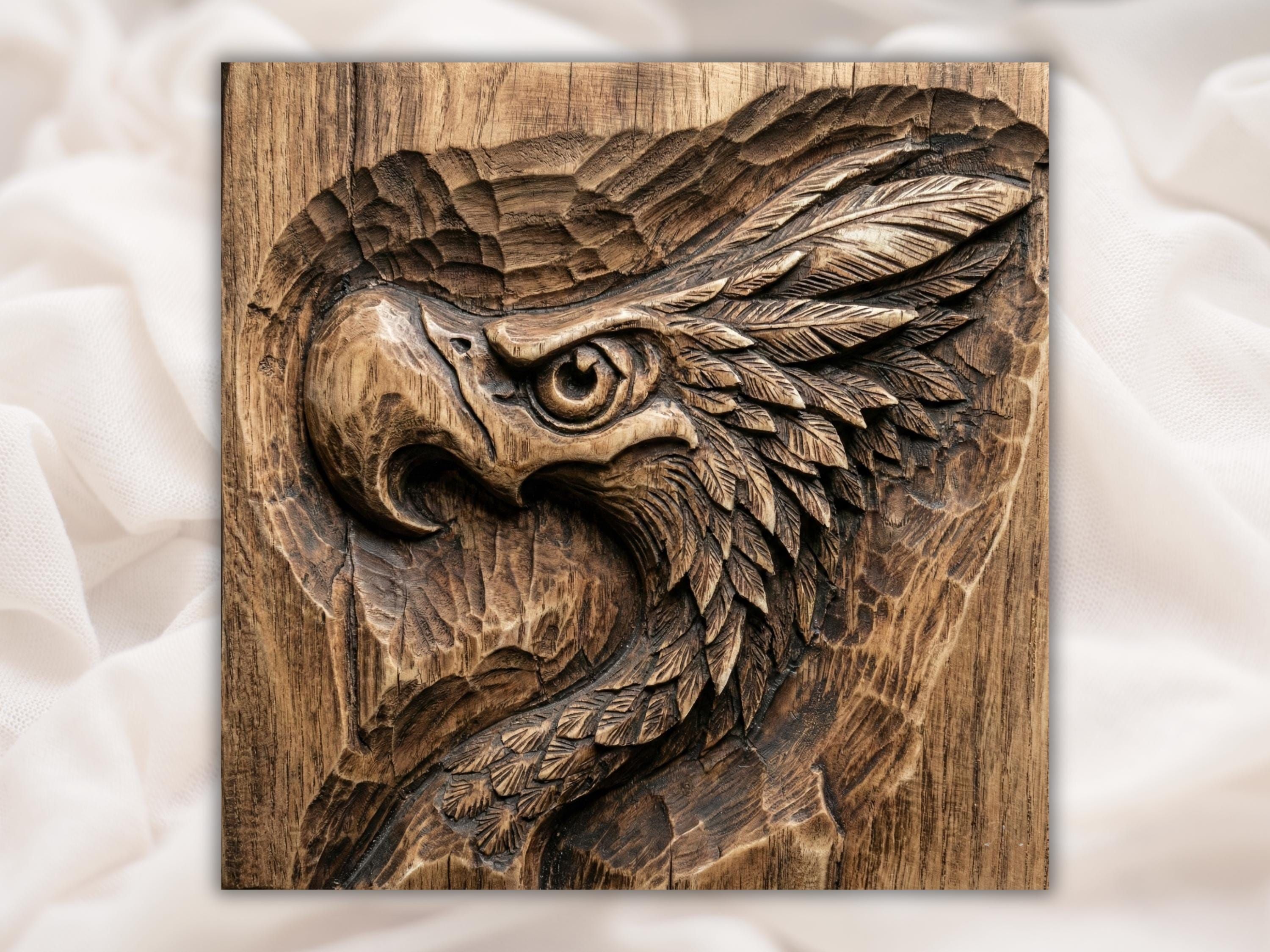 Bas-relief wood carving of an eagle head in profile with a sharp eye and layered feathers