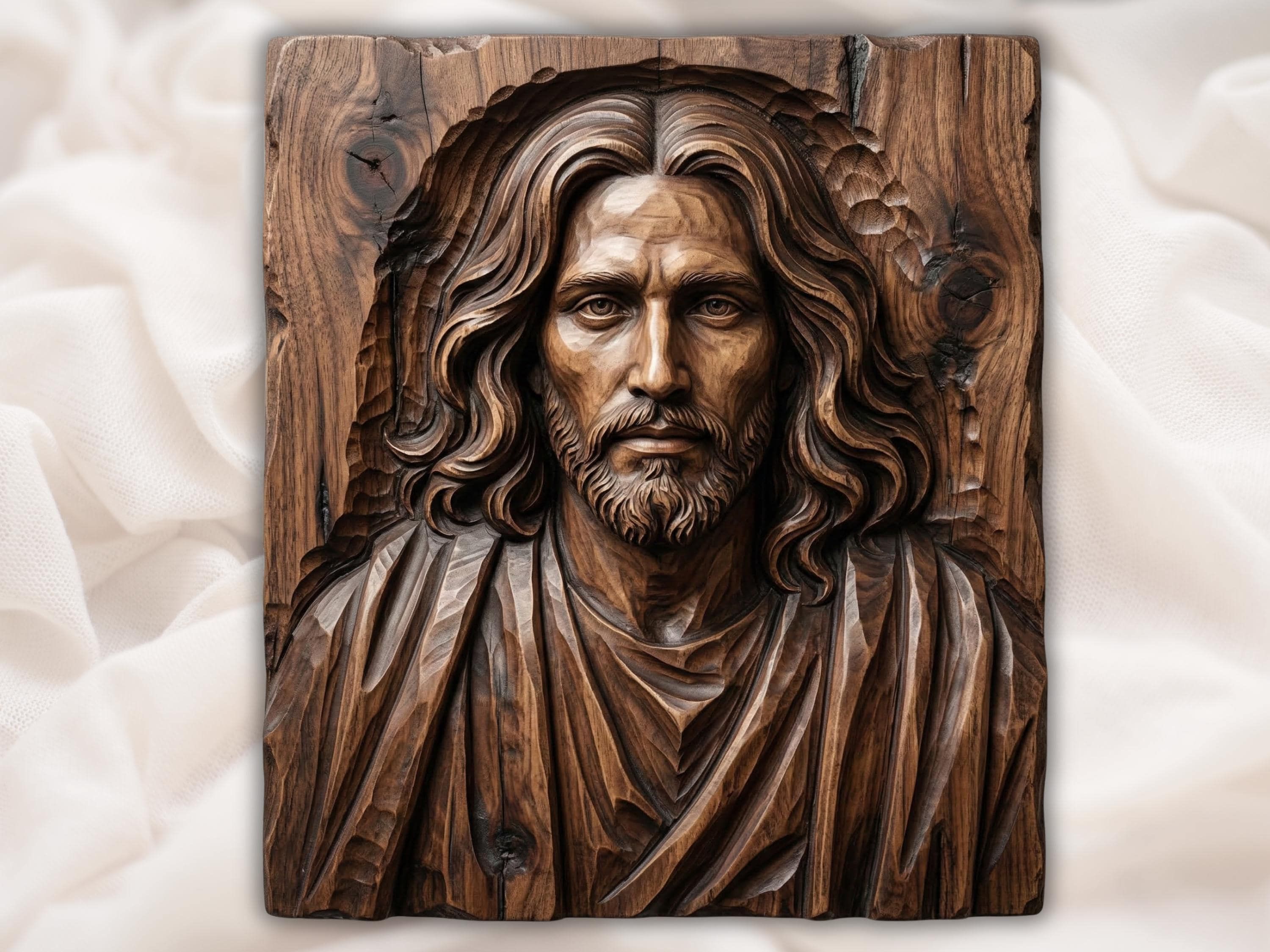 Carved wood bas-relief of the face of Christ with long flowing hair, full beard, and draped robe