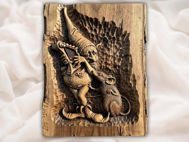 Carved wood relief of a gnome in a tall cap playing a lyre for an upright mouse