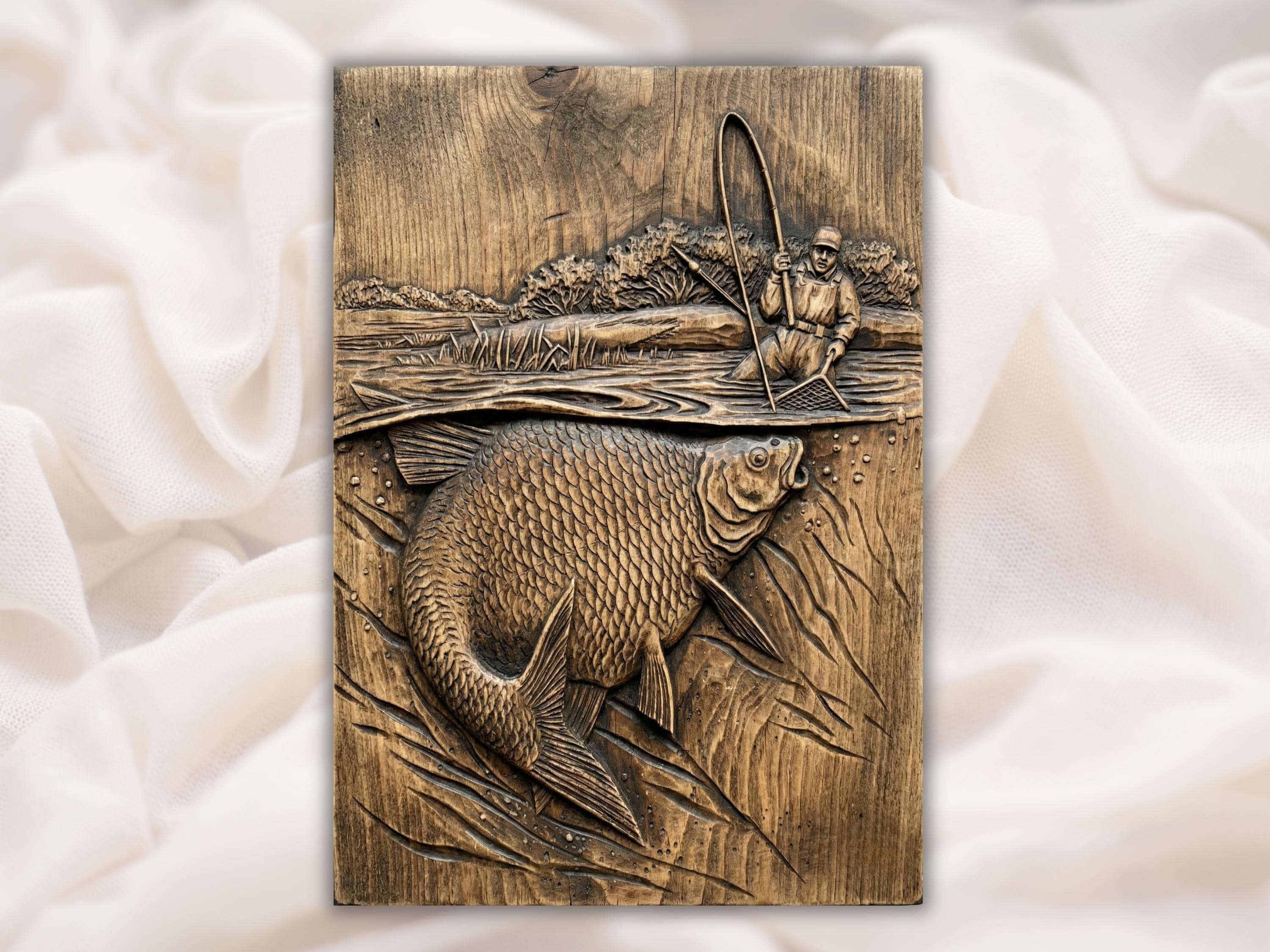 Carved wood bas-relief of a fisherman with a bent rod and a large leaping carp over rippling water