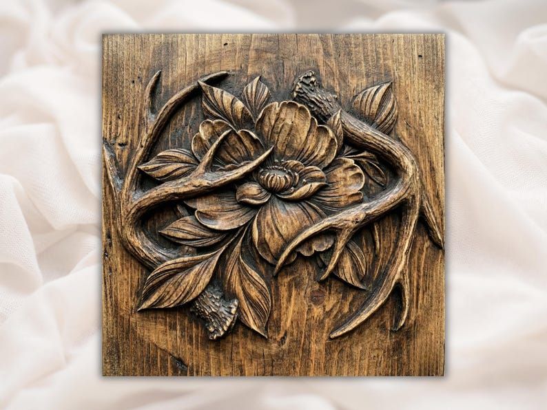 Carved wood bas-relief of a peony flower wrapped in deer antlers with leaves and mushrooms