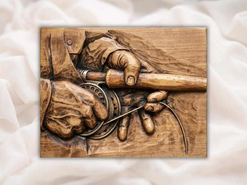 Carved wood relief of two hands holding a fly fishing rod and reel, threading the line onto the spool
