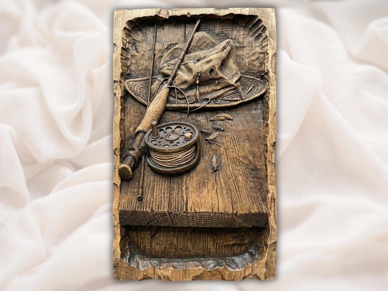 Carved wood relief of a fly fishing rod, reel with line, felt hat and flies on weathered planks.