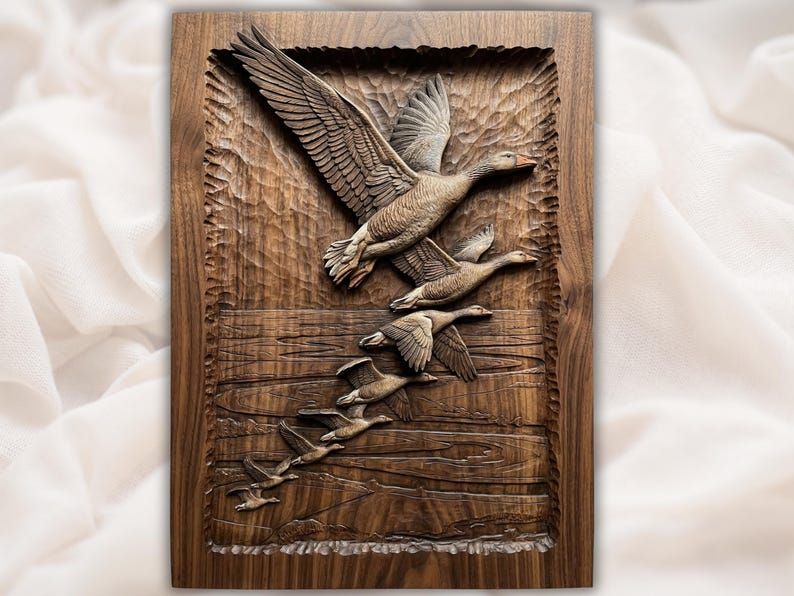 Bas-relief wood carving of a flock of geese flying down over rippling water on a walnut panel