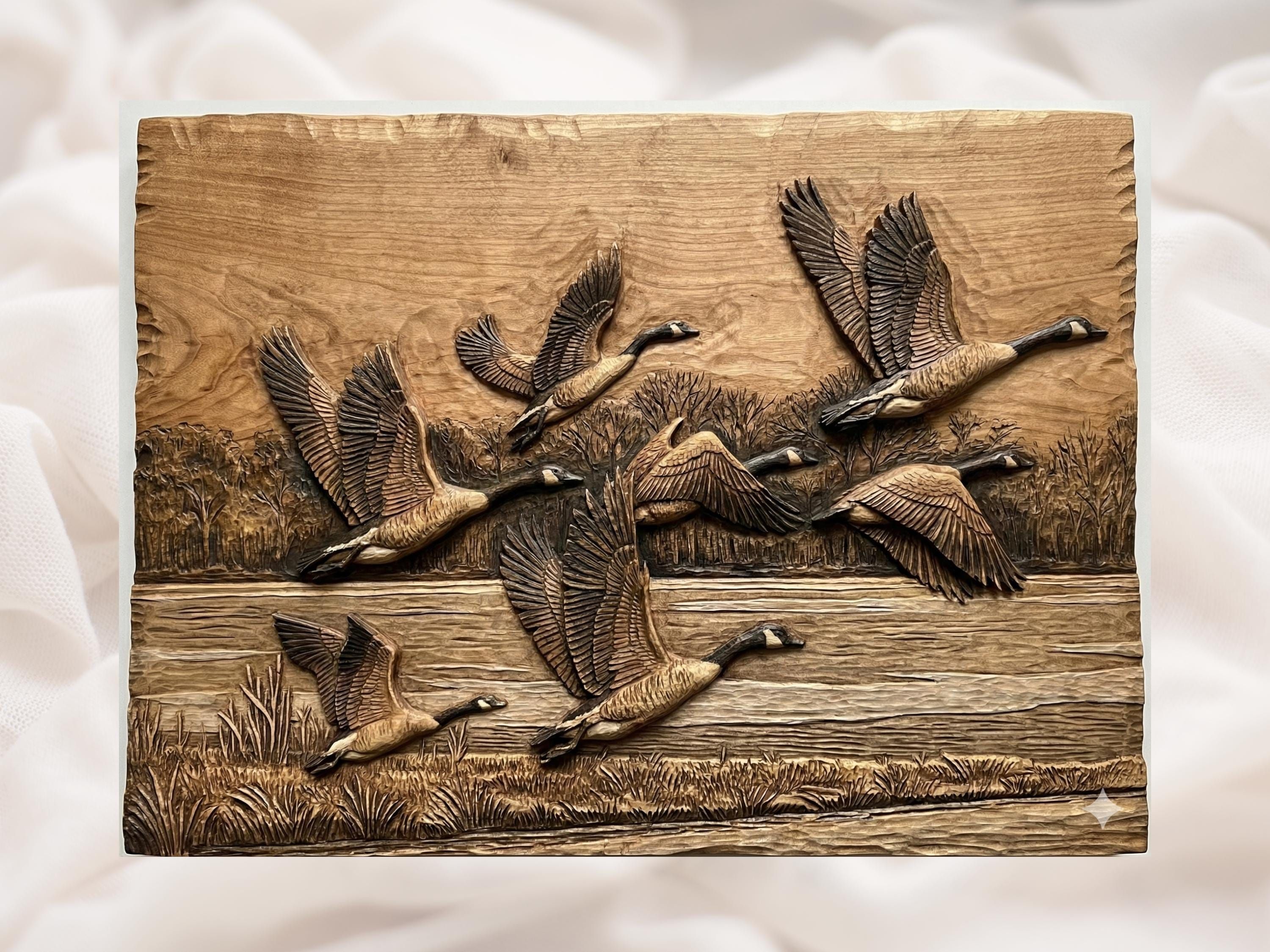 Carved wood bas-relief of Canada geese flying over a marsh with bare trees and tall grass