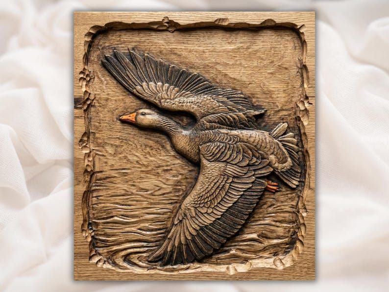 Carved wood bas-relief of a greylag goose in flight with spread wings over rippling water in a rustic frame