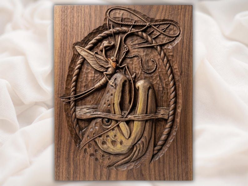 Carved wood relief of a tiny cowboy lassoing a leaping trout inside a rope oval frame.