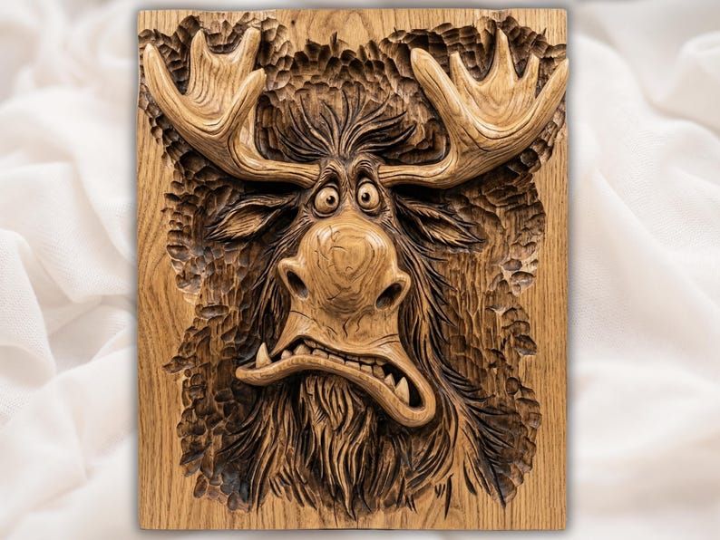 Bas-relief wood carving of a cartoon moose with bug eyes, big antlers, and a goofy open-mouthed grin