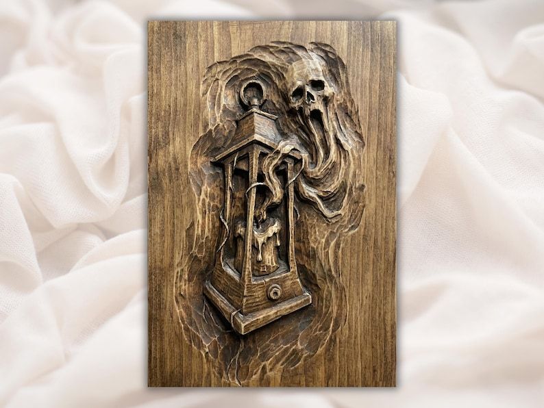 Bas-relief carving of a hanging lantern with dripping wax and a ghostly skull spirit in swirling smoke