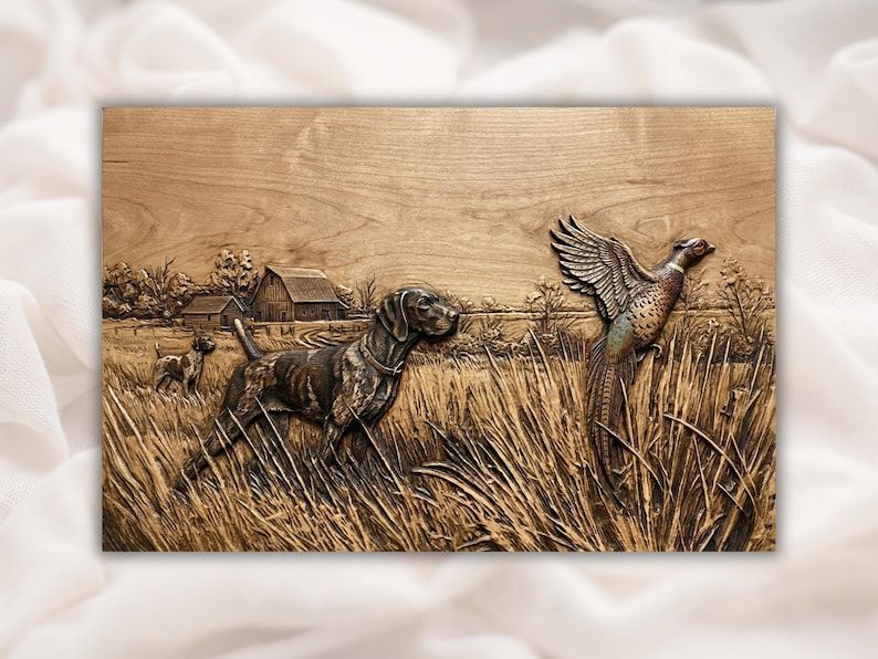 Carved wood bas-relief of a hunting dog pointing as a pheasant flushes over a grassy field with a barn