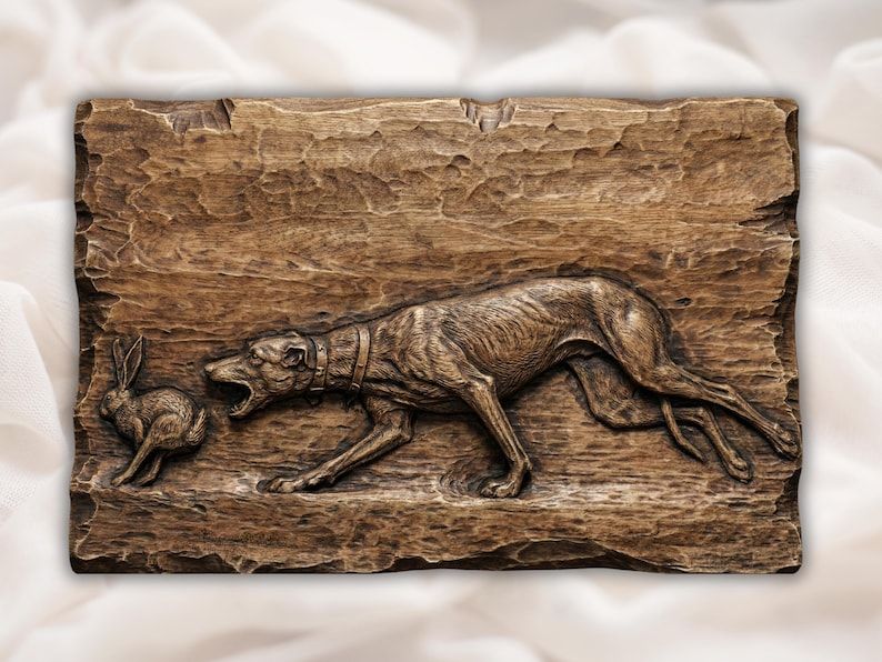 Bas-relief wood carving of a lean greyhound chasing a running hare across a chiseled background panel