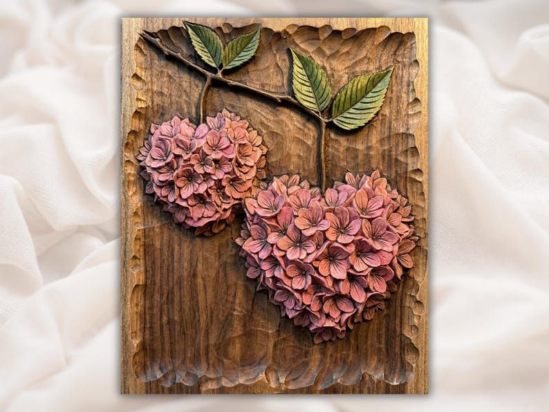 Bas-relief wood carving of two hydrangea flower clusters shaped like hearts on a leafy branch