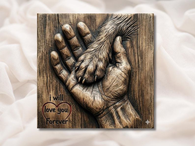 Carved relief of a dog paw resting in a human hand with the words I will love you forever in a heart.