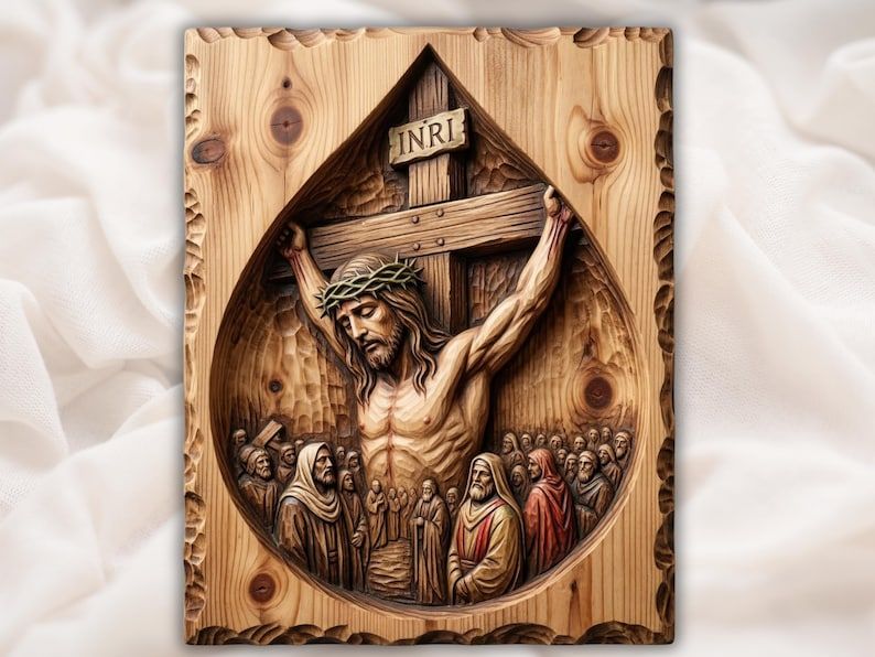 Carved bas-relief of Jesus crucified on a cross with INRI sign and crowd inside a teardrop frame