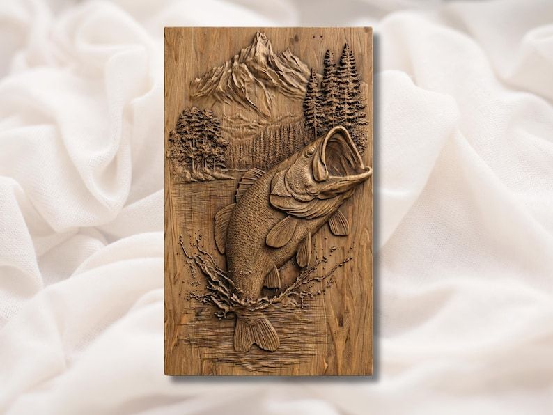 Carved wood relief of a largemouth bass leaping from a lake with pine trees and a mountain behind it