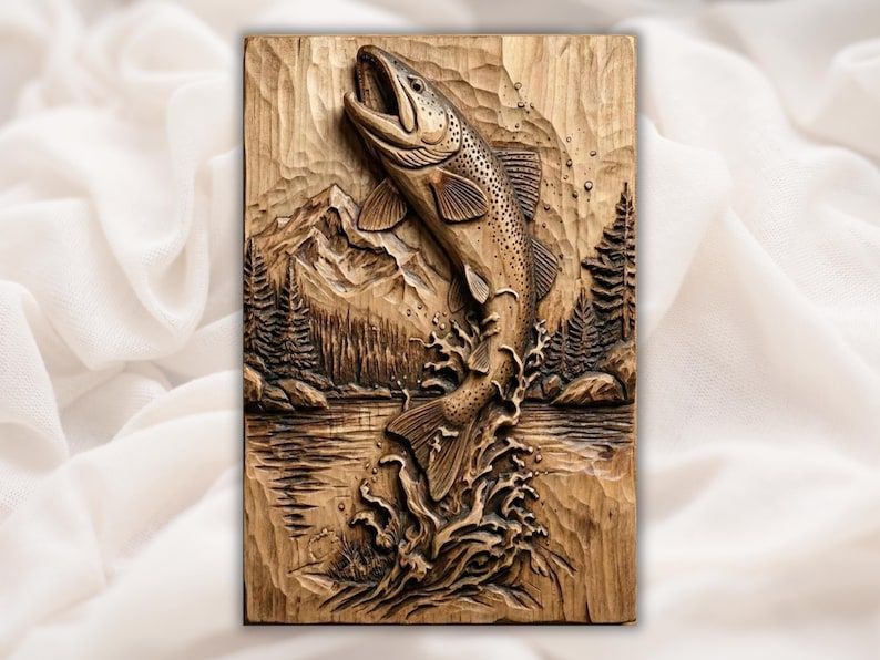 Carved wood bas-relief of a trout leaping from a lake with mountains and pine trees behind it