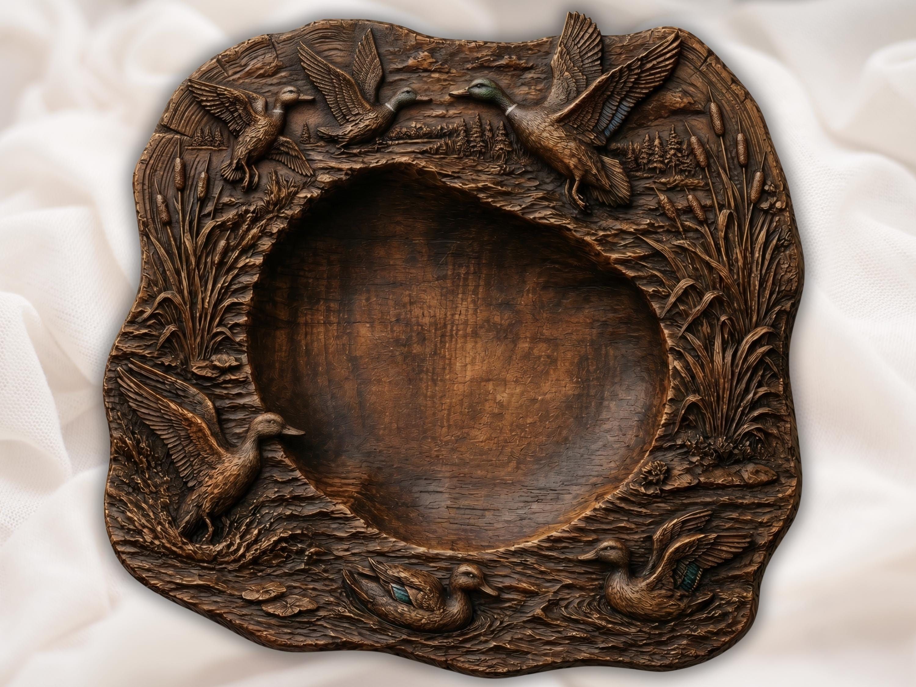 Bas-relief wood carving of mallard ducks flying and swimming around a deep live-edge serving platter with marsh reeds and pines
