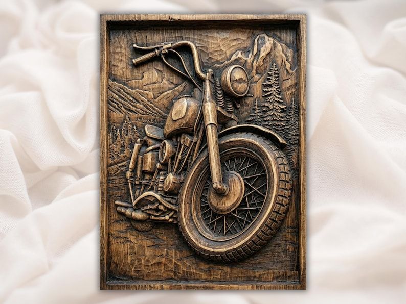 Carved wood bas-relief of a vintage motorcycle with spoked wheel set against mountains and pine trees.
