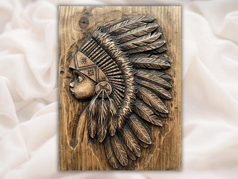 Bas-relief wood carving of a young Native American girl in profile wearing a feathered headdress