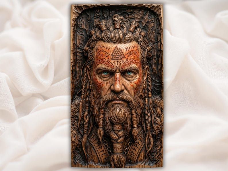Bas-relief carving of a Norse Viking warrior with braided beard, topknot, rune markings, and face tattoos.