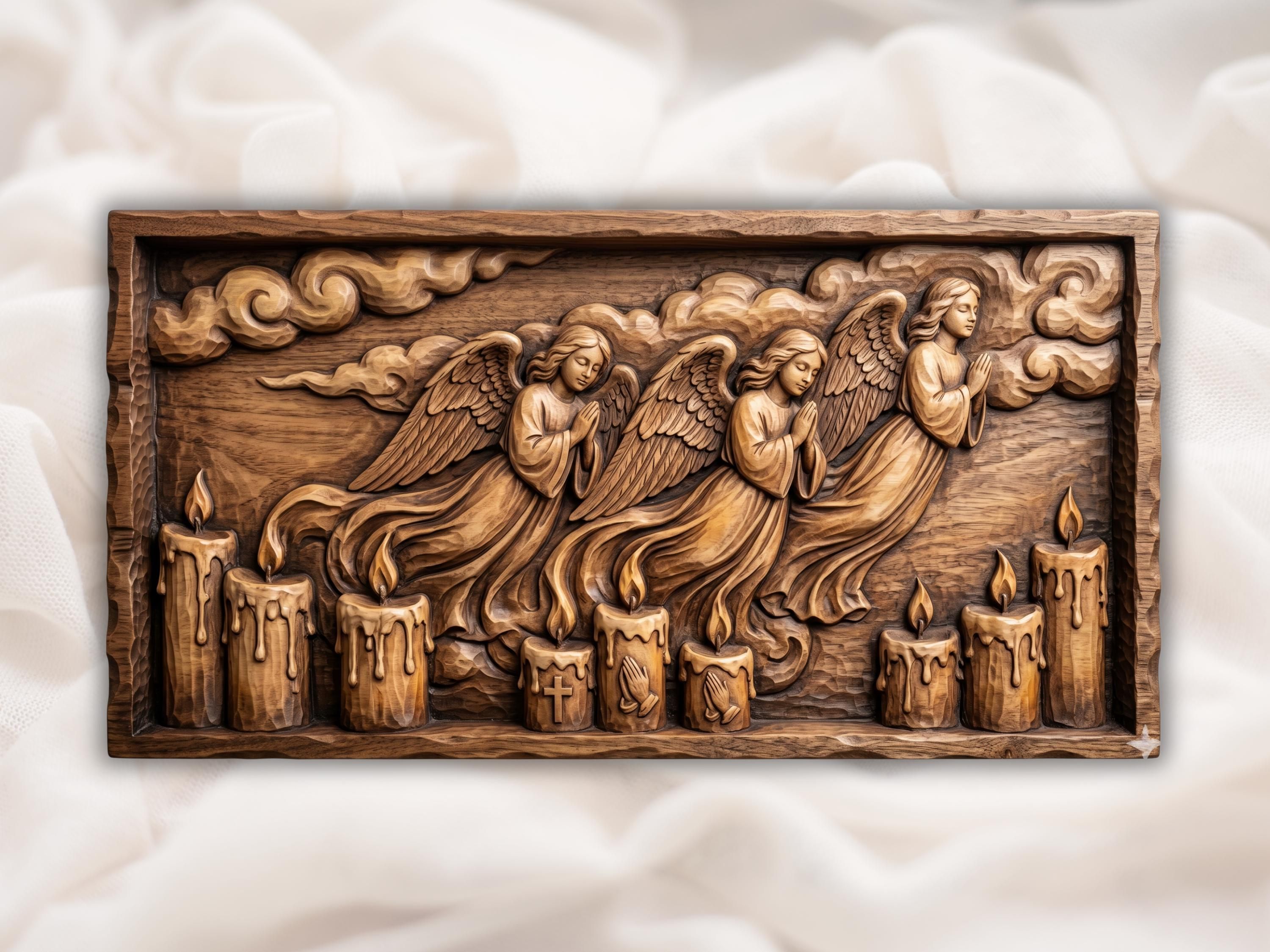 Carved wood bas relief of two praying angels with feathered wings above three candles, a cross, and praying hands.