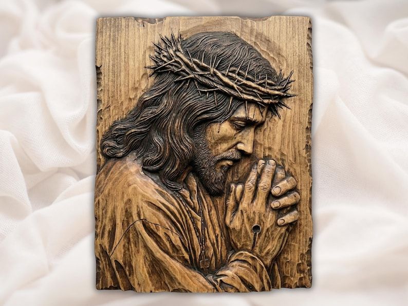 Carved wood bas-relief of Jesus in prayer with folded hands and a crown of thorns on a grain panel