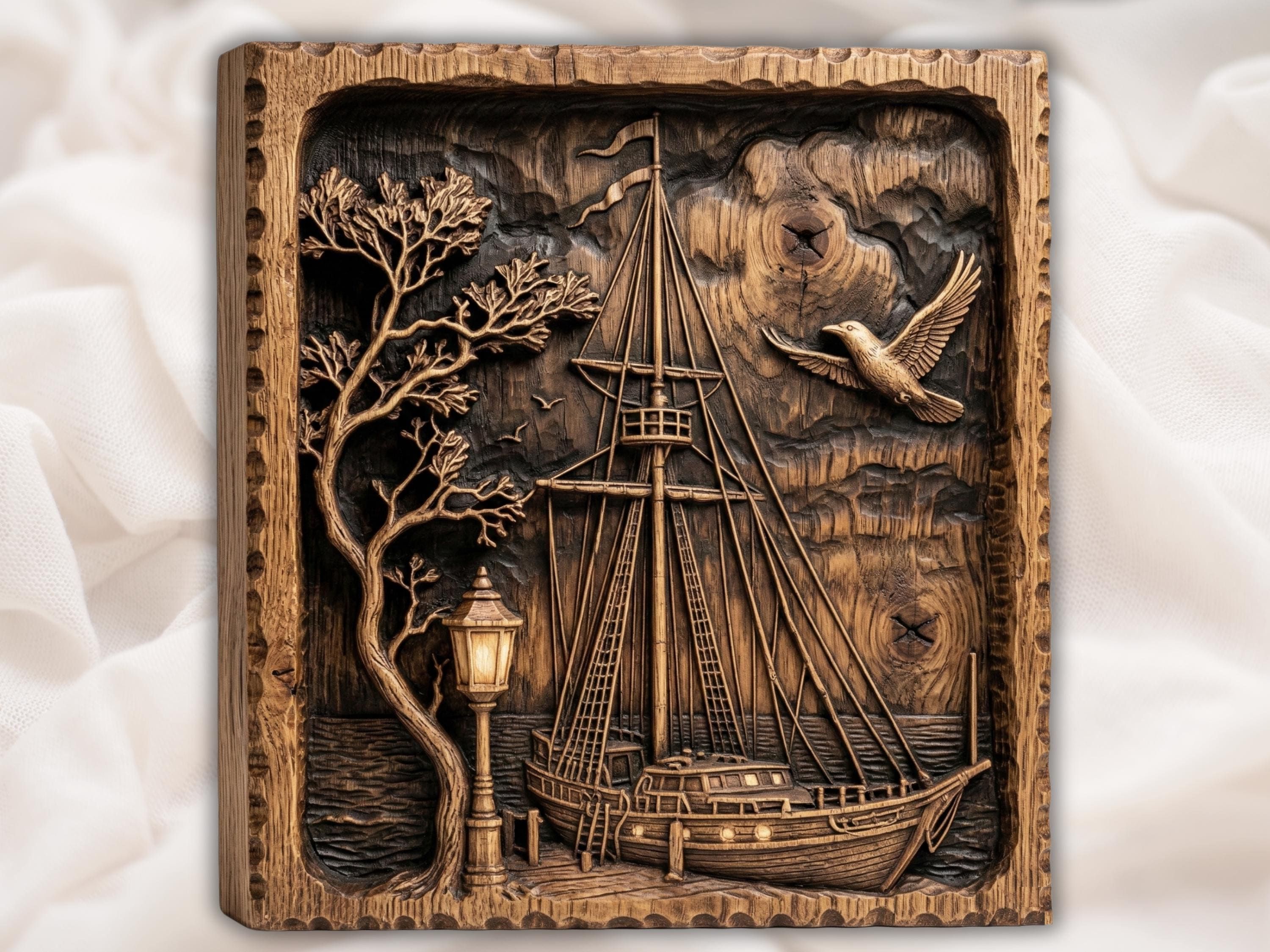 Carved wood bas-relief of a tall sailing ship at a harbor dock with a glowing street lamp, leaning tree, and gulls in the sky.