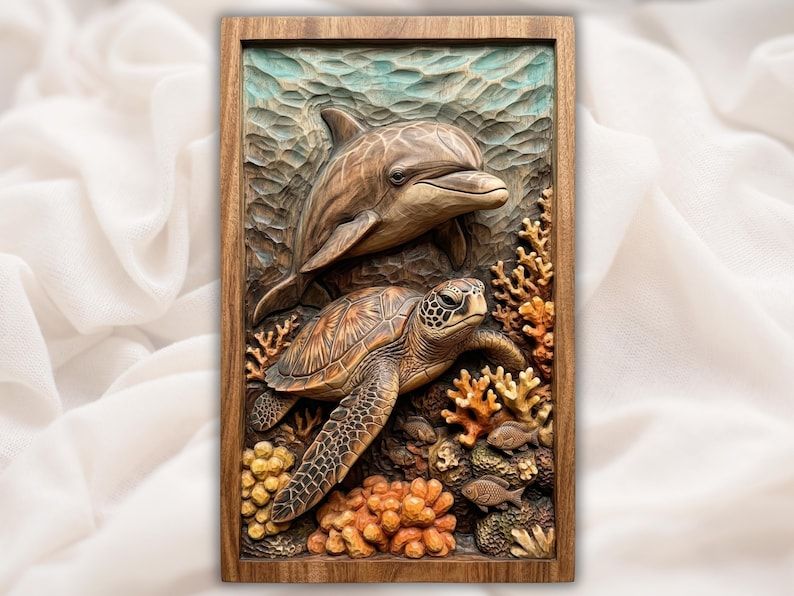 Carved wood relief of a dolphin swimming above a sea turtle on a coral reef with small fish, in a wood frame.