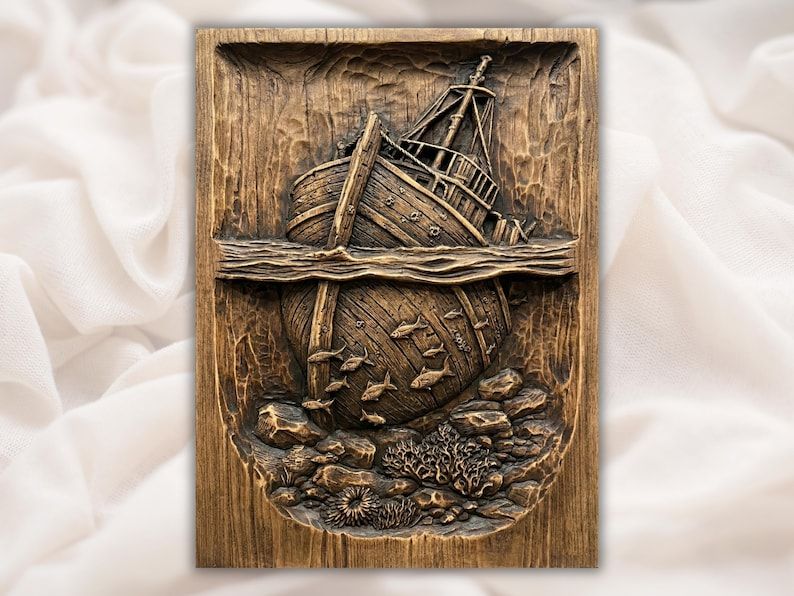 Carved wood relief of a sinking shipwreck above the waterline with fish, coral, and rocks below the sea