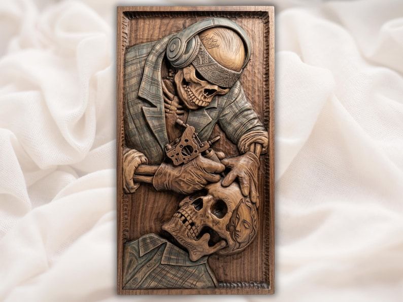 Carved wood relief of a skeleton tattoo artist in a flat cap inking a large skull
