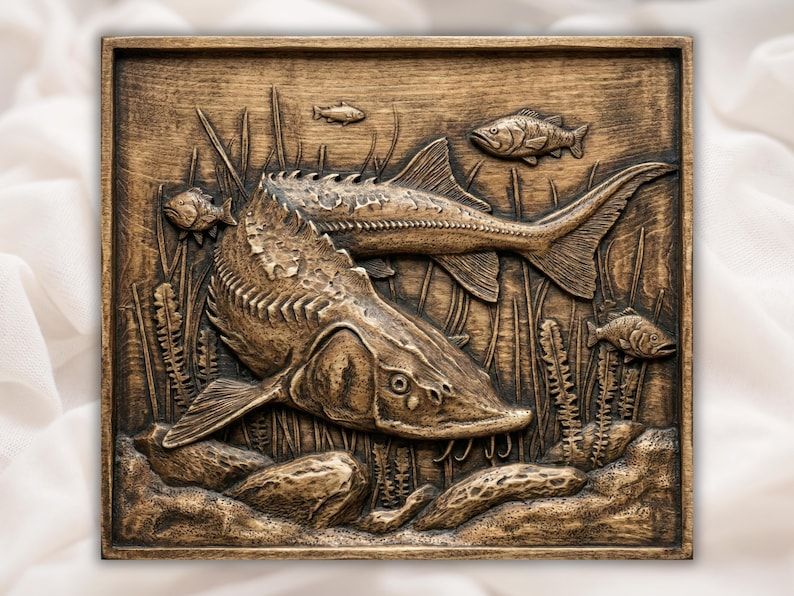 Carved wood relief of a sturgeon swimming over riverbed stones with reeds and small fish in the background